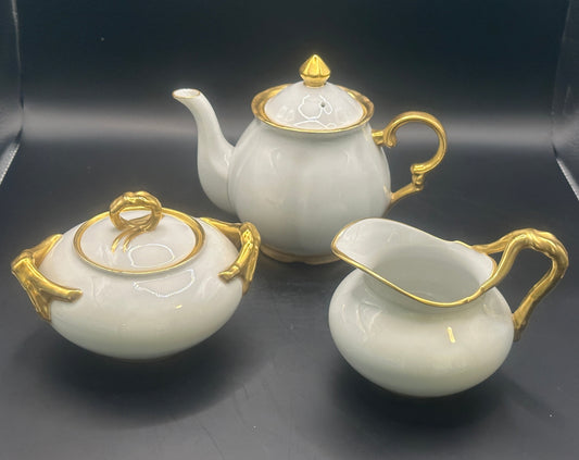 White tea set with gold.